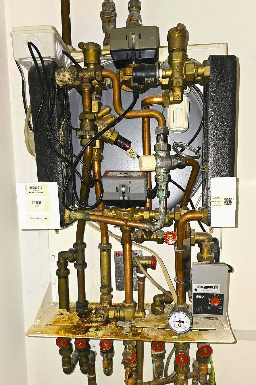 HIU Complex plumbing system with valves and gauges.